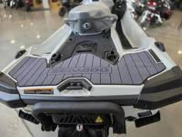 Slide: The Image of Rear view of a 2026 Sea-Doo GTX jet ski in showroom. - 14