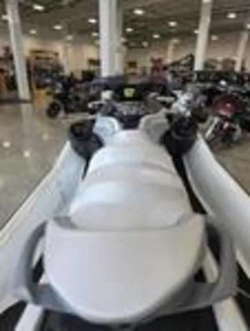 Slide: The Image of 2026 Sea-Doo GTX jet ski displayed in showroom. - 15