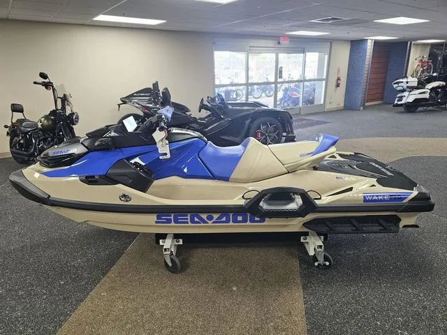 Slide: The Image of 2026 Sea-Doo Wake jet ski in showroom, blue and beige design. - 4