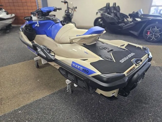 Slide: The Image of 2026 Sea-Doo Wake Pro jet ski in showroom. - 5