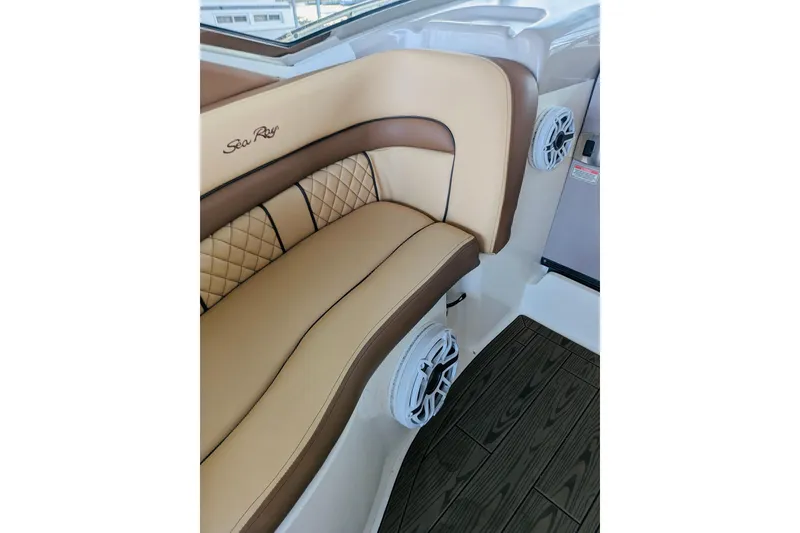 Slide: The Image of Luxurious seating on 2002 Sea Ray Sundancer 320 boat with elegant design and speakers. - 13
