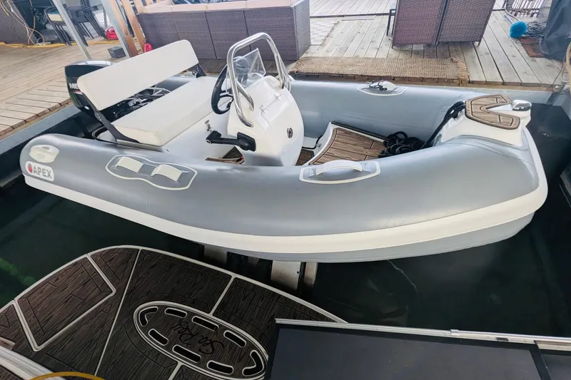 Slide: The Image of Inflatable boat docked beside a 2002 Sea Ray Sundancer 320 yacht. - 23