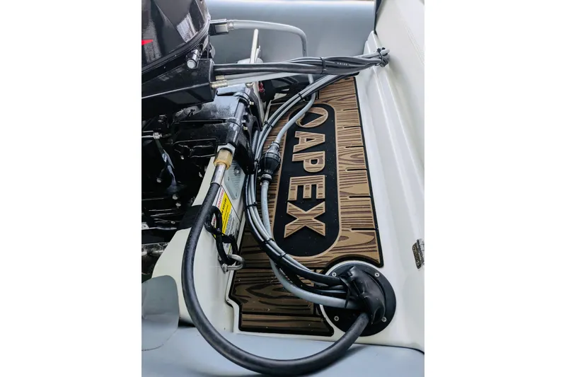 Slide: The Image of Engine compartment of 2002 Sea Ray Sundancer 320 with Apex branding and cables. - 26