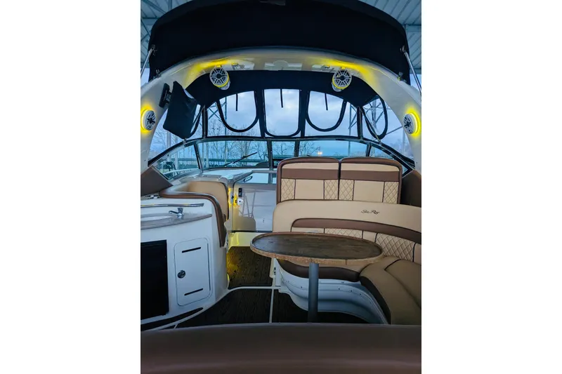 Slide: The Image of Interior of 2002 Sea Ray Sundancer 320 yacht with elegant seating and table. - 27