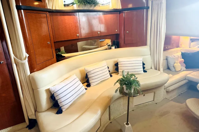 Slide: The Image of Luxurious interior of 2002 Sea Ray Sundancer 320 yacht with elegant seating and decor. - 30