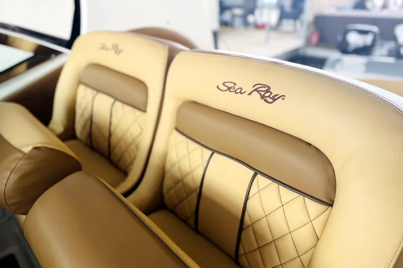 Slide: The Image of Luxurious leather seats in a 2002 Sea Ray Sundancer 320 boat interior. - 6