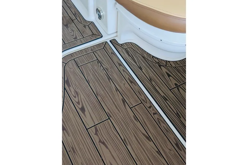 Slide: The Image of Teak-style flooring on 2002 Sea Ray Sundancer 320 boat interior. - 9