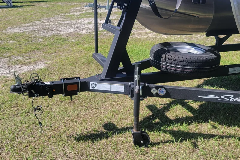 Slide: The Image of Trailer hitch of 2023 Sun Tracker Bass Buggy 18 DLX on grassy field. - 3