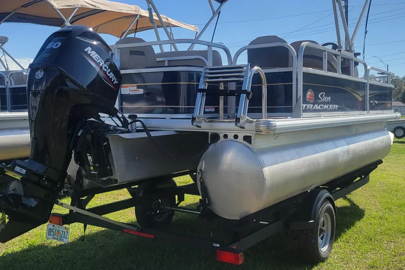 Slide: The Image of 2023 Sun Tracker Bass Buggy 18 DLX pontoon boat with Mercury outboard motor. - 5