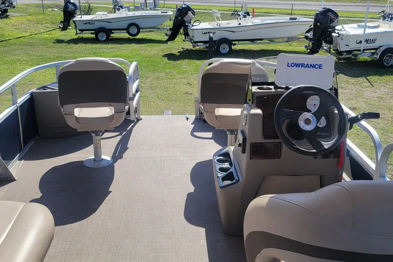 Slide: The Image of 2023 Sun Tracker Bass Buggy 18 DLX interior with steering console and seating. - 7