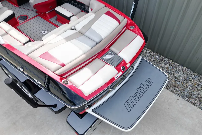 Slide: The Image of 2012 Malibu Wakesetter 22 MXZ boat with red and white interior, viewed from above. - 9