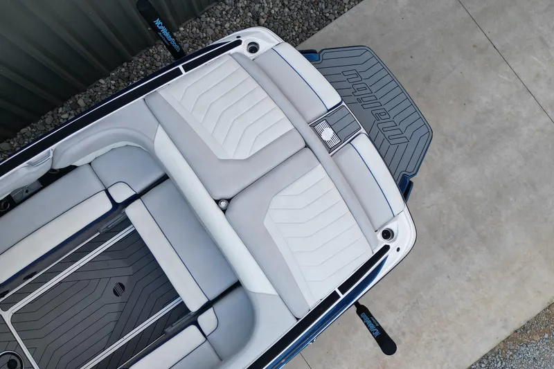 Slide: The Image of 2017 Malibu Wakesetter 25 LSV boat interior with sleek seating and deck design. - 11