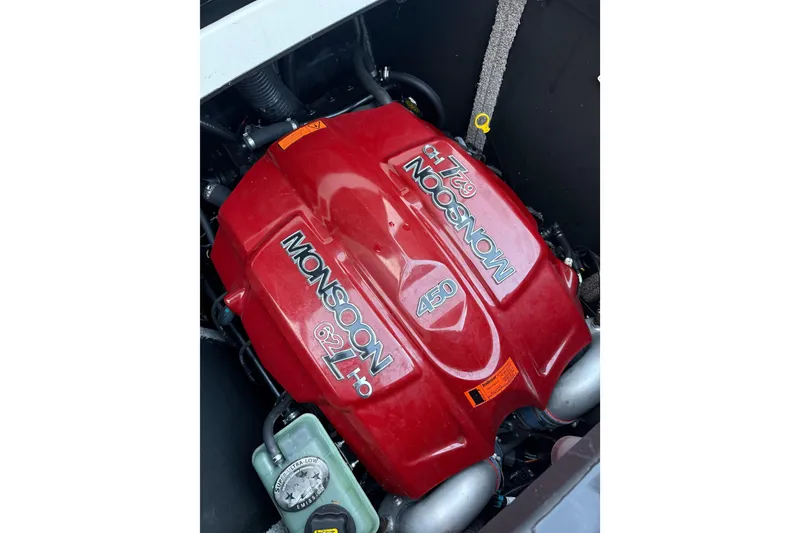 Slide: The Image of 2017 Malibu Wakesetter 25 LSV Monsoon 6.2L engine, red cover, 450 horsepower. - 16