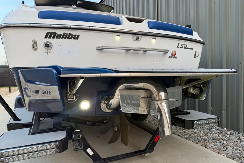 Slide: The Image of 2017 Malibu Wakesetter 25 LSV boat rear view with Surf Gate technology. - 19