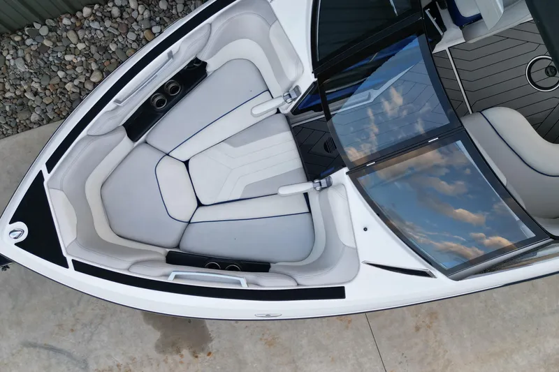 Slide: The Image of 2017 Malibu Wakesetter 25 LSV boat interior with plush seating and sleek design. - 3