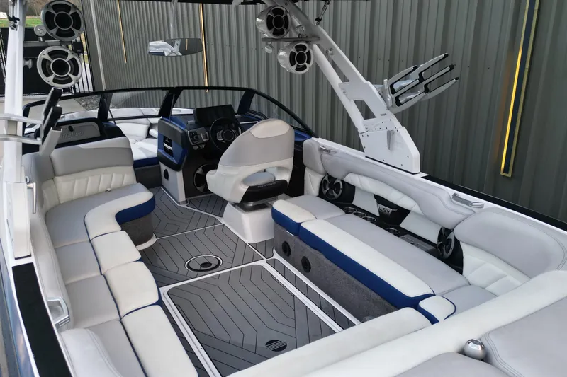Slide: The Image of 2017 Malibu Wakesetter 25 LSV interior with luxurious seating and advanced audio system. - 5