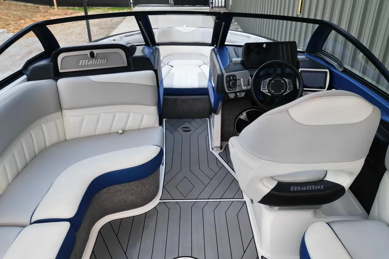 Slide: The Image of 2017 Malibu Wakesetter 25 LSV interior with sleek seating and modern dashboard design. - 7