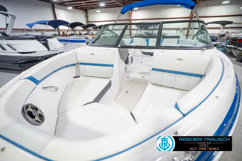 Slide: The Image of 2015 Regal 2000 ESX Bowrider with white and blue interior in showroom. - 12
