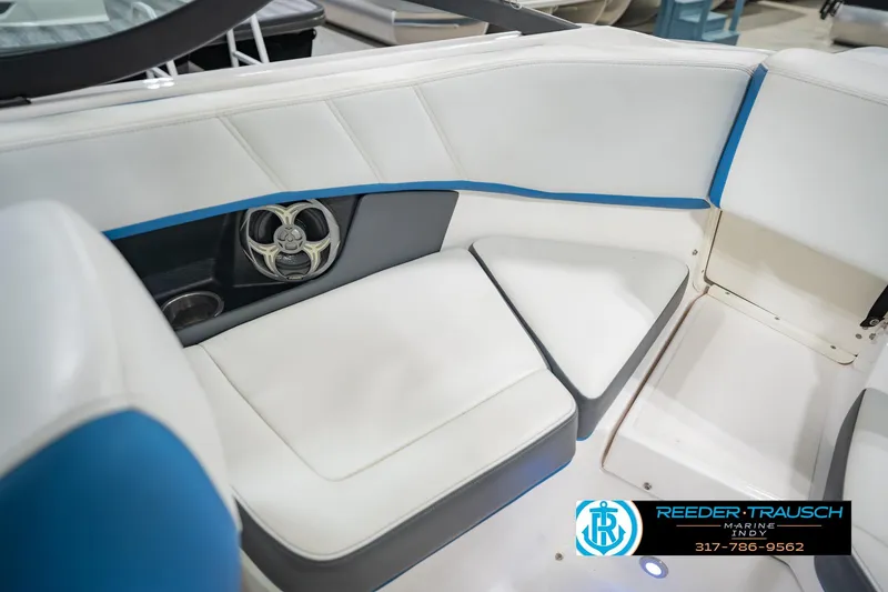 Slide: The Image of 2015 Regal 2000 ESX Bowrider interior with white and blue seating, speaker, and cup holder. - 22