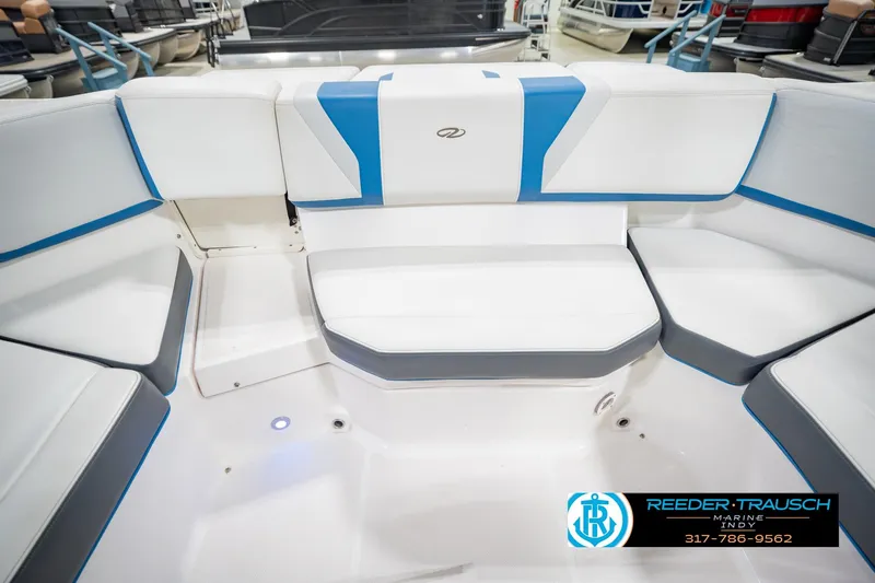 Slide: The Image of Interior seating of a 2015 Regal 2000 ESX Bowrider boat with white and blue upholstery. - 24