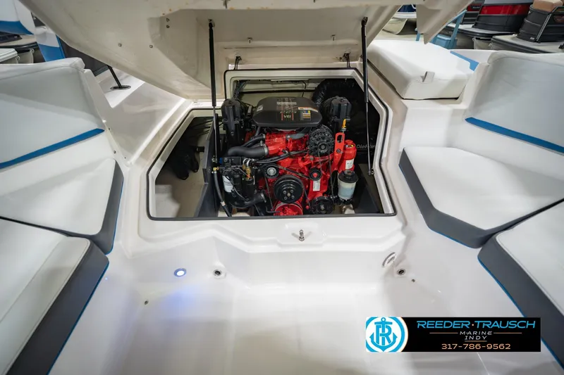 Slide: The Image of 2015 Regal 2000 ESX Bowrider engine compartment with visible red engine components. - 25