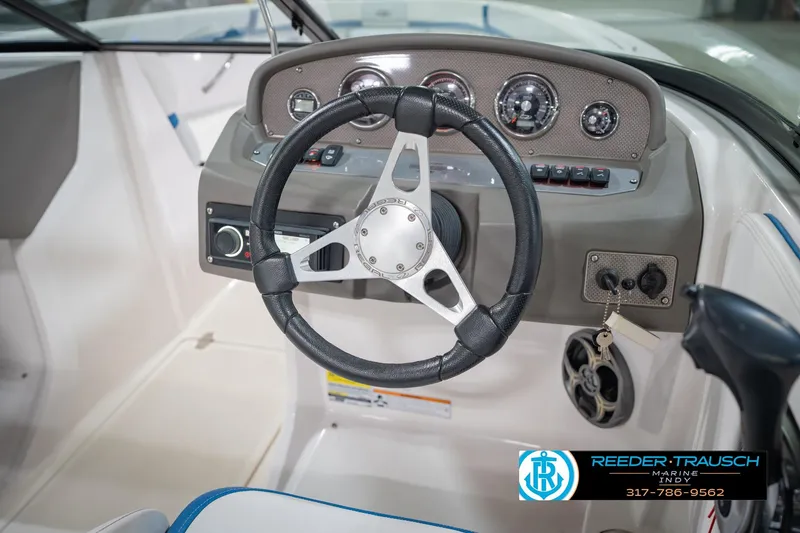 Slide: The Image of 2015 Regal 2000 ESX Bowrider dashboard with steering wheel and controls. - 28