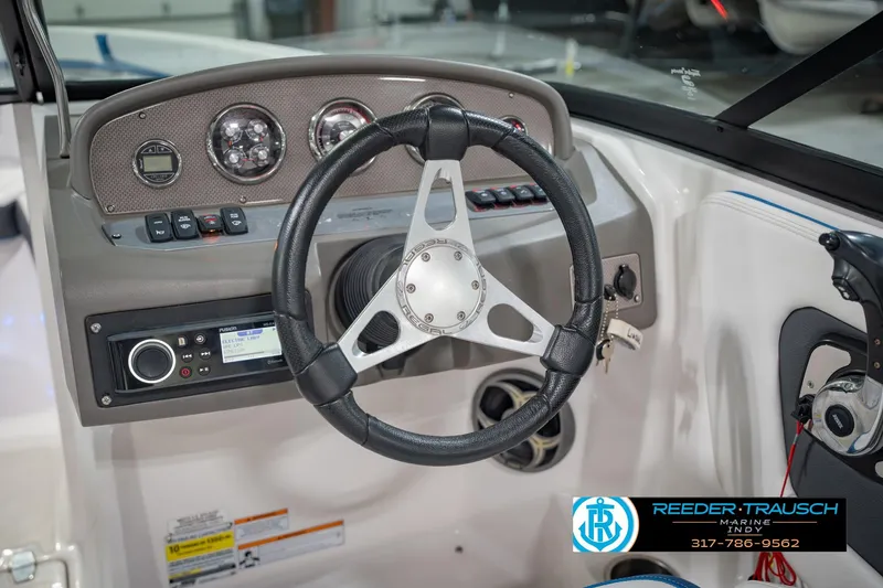 Slide: The Image of Steering console of 2015 Regal 2000 ESX Bowrider with gauges and controls. - 29