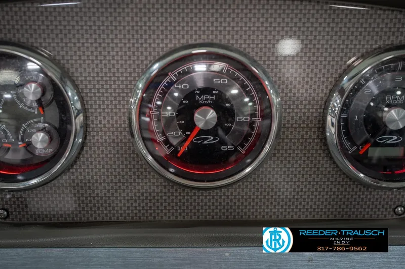 Slide: The Image of Dashboard gauges of a 2015 Regal 2000 ESX Bowrider boat. - 34