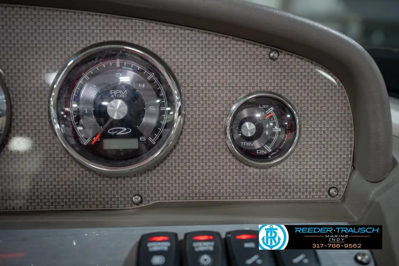 Slide: The Image of Dashboard of 2015 Regal 2000 ESX Bowrider with RPM and trim gauges. - 35