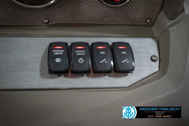 Slide: The Image of Control panel of a 2015 Regal 2000 ESX Bowrider with labeled switches. - 36