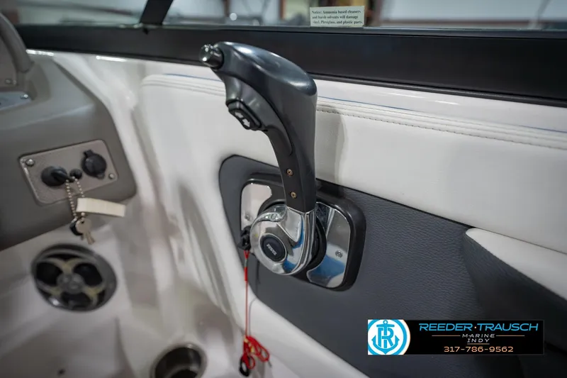 Slide: The Image of Close-up of 2015 Regal 2000 ESX Bowrider throttle control in boat cockpit. - 37