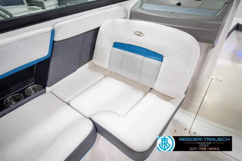 Slide: The Image of 2015 Regal 2000 ESX Bowrider interior seating with cup holders, featuring white and blue upholstery. - 41