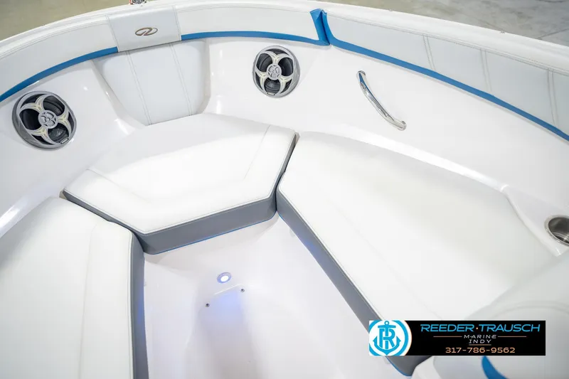 Slide: The Image of 2015 Regal 2000 ESX Bowrider interior with white seating and blue accents. - 42