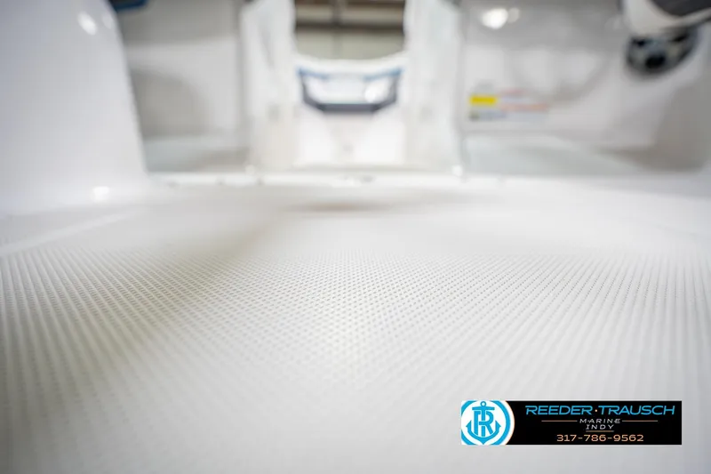 Slide: The Image of 2015 Regal 2000 ESX Bowrider interior with textured flooring, Reeder Trausch Marine logo. - 45