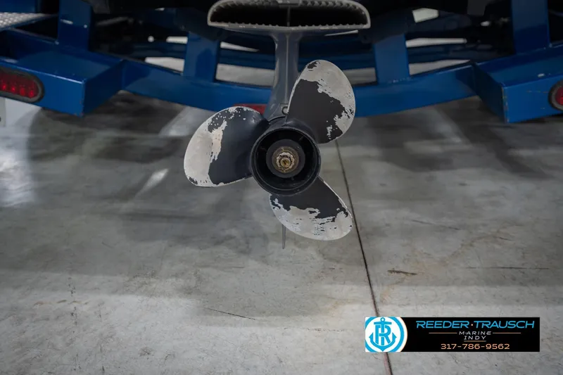 Slide: The Image of Propeller of 2015 Regal 2000 ESX Bowrider on blue trailer in garage. - 49
