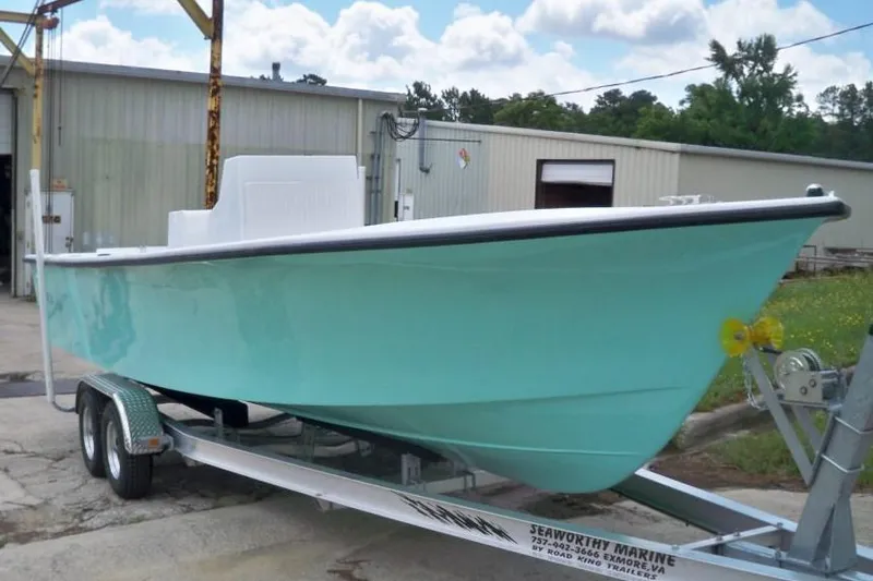 Slide: The Image of Manufacturer Provided Image: 2026 C-Hawk 25 Center Console boat on trailer, light blue hull, outdoor setting. - 4