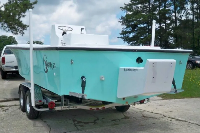 Slide: The Image of Manufacturer Provided Image: 2026 C-Hawk 25 Center Console boat on trailer, light blue color, parked outdoors. - 6
