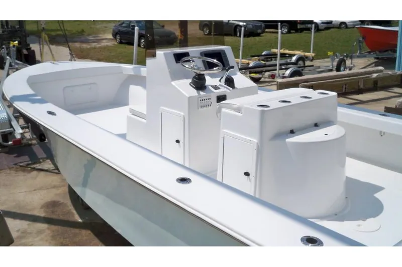 Slide: The Image of Manufacturer Provided Image: 2026 C-Hawk 25 Center Console boat with sleek white design and spacious deck. - 7