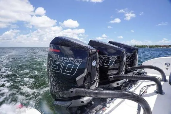 Slide: The Image of 2023 Fountain 38 Tournament Edition with triple Mercury Racing 450 engines on open water. - 10