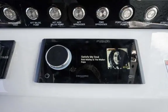 Slide: The Image of Control panel of 2023 Fountain 38 Tournament Edition boat with music display. - 18