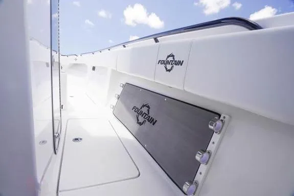 Slide: The Image of 2023 Fountain 38 Tournament Edition boat interior with sleek white design and branded details. - 24