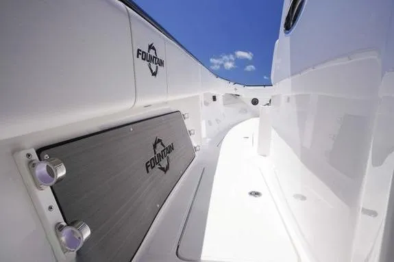 Slide: The Image of 2023 Fountain 38 Tournament Edition boat interior with sleek white design and logo. - 25