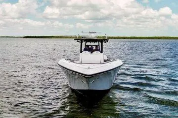 Slide: The Image of 2023 Fountain 38 Tournament Edition boat on open water under a cloudy sky. - 3