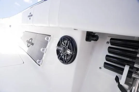 Slide: The Image of 2023 Fountain 38 Tournament Edition boat interior with speaker and rod holders. - 35