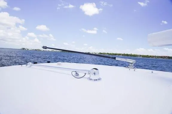 Slide: The Image of 2023 Fountain 38 Tournament Edition boat on calm water under blue sky. - 36