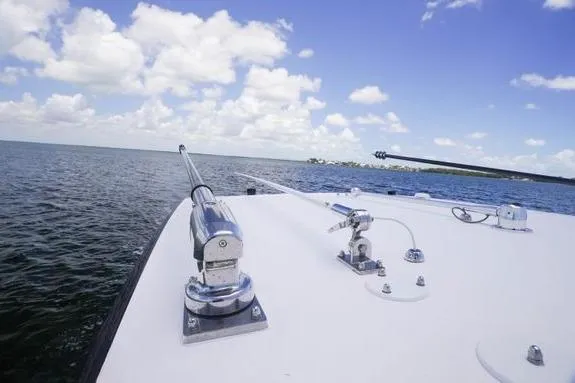 Slide: The Image of 2023 Fountain 38 Tournament Edition boat on open water under blue sky. - 37