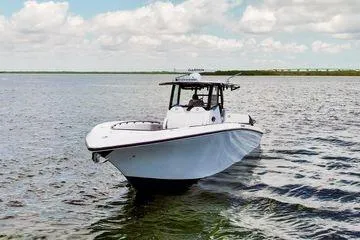 Slide: The Image of 2023 Fountain 38 Tournament Edition boat on open water under a cloudy sky. - 4