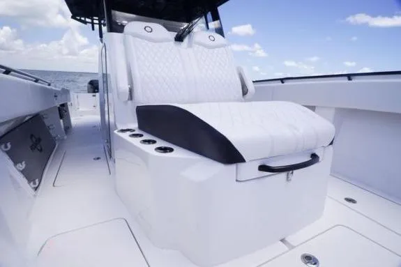 Slide: The Image of 2023 Fountain 38 Tournament Edition boat interior with luxurious seating and ocean backdrop. - 41