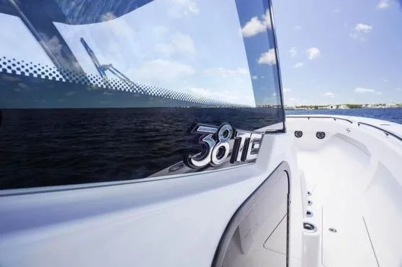 Slide: The Image of 2023 Fountain 38 Tournament Edition boat on water, showcasing sleek design and logo. - 43