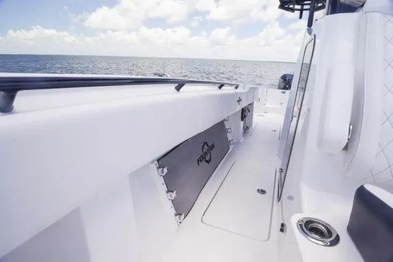 Slide: The Image of 2023 Fountain 38 Tournament Edition boat deck with ocean view, featuring sleek design and storage. - 45
